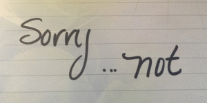 Image of handwritten "Sorry...not sorry" on lined paper